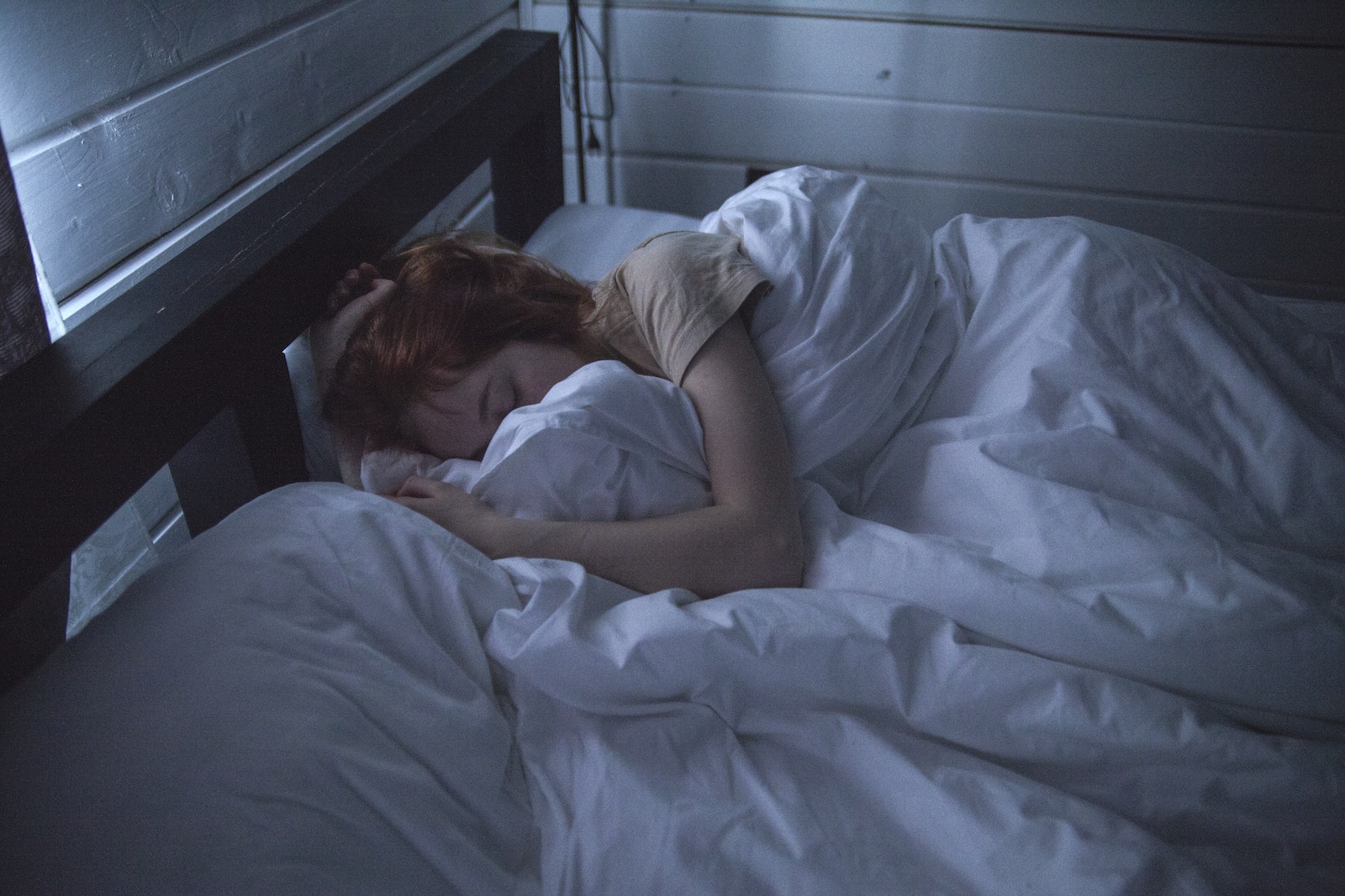Sleep Deprivation Linked to Junk Food Cravings woman sleeping