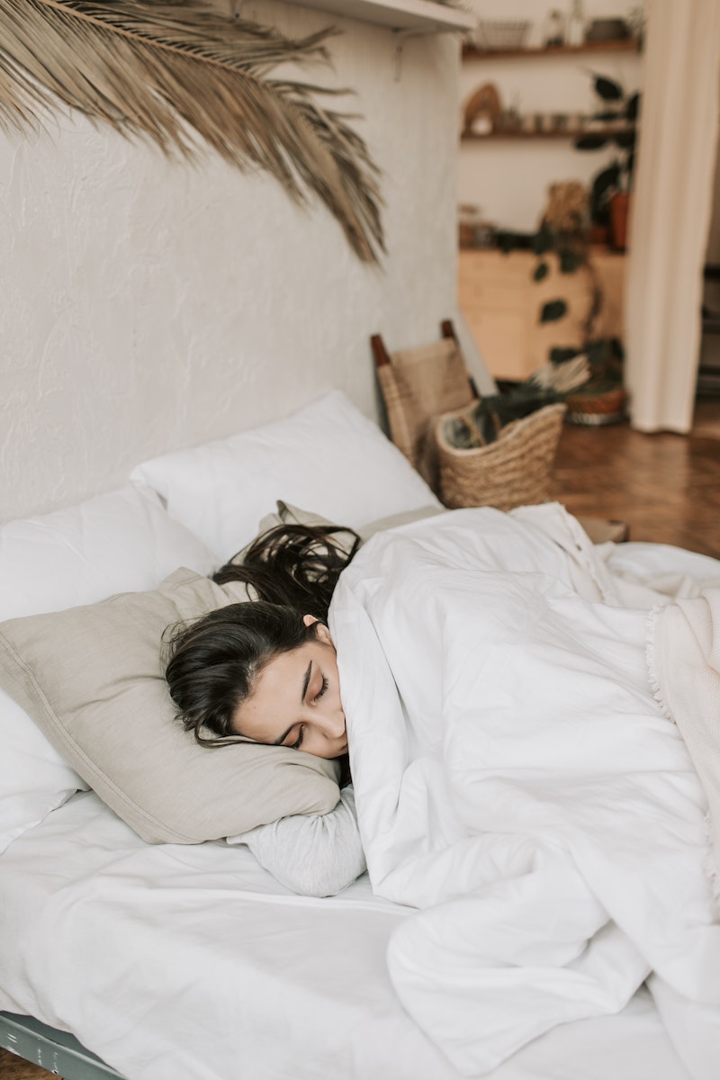 Woman Sleeping on a Bed