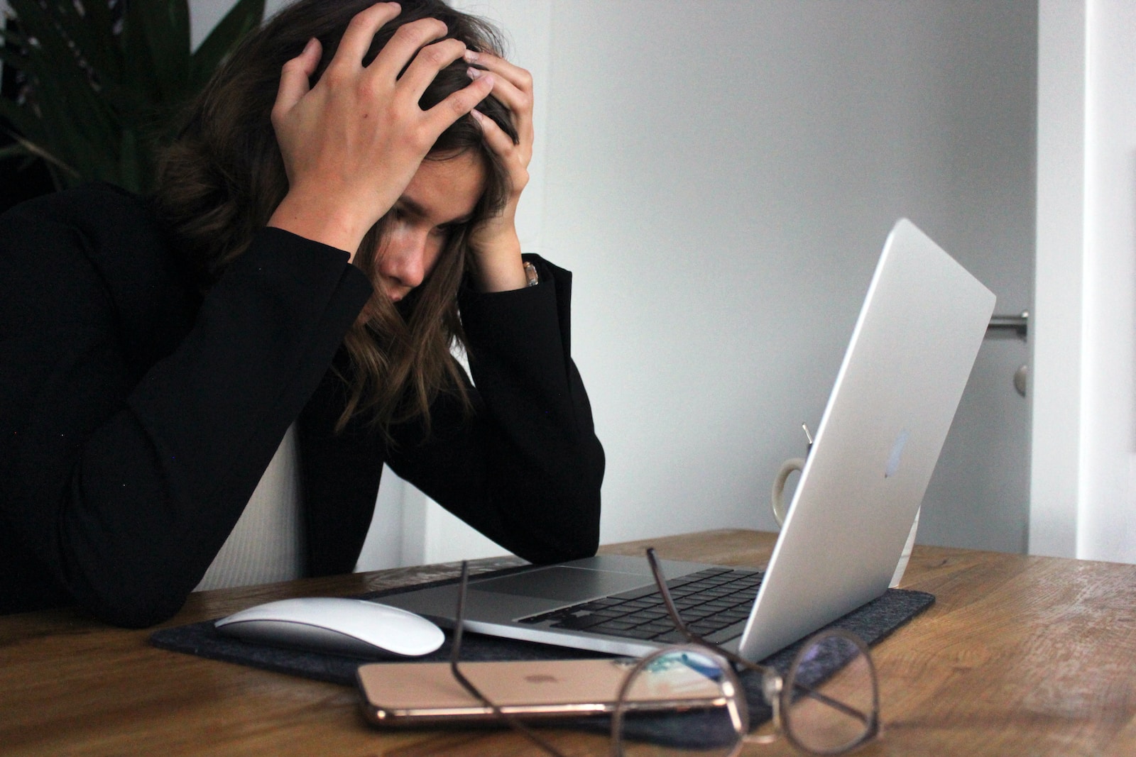 woman covering her face with her hands