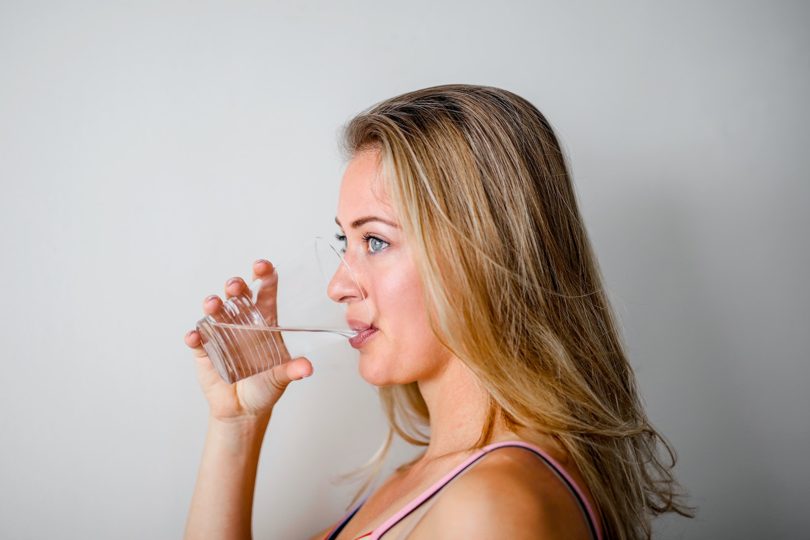 Woman Drinking from Plastic Cup