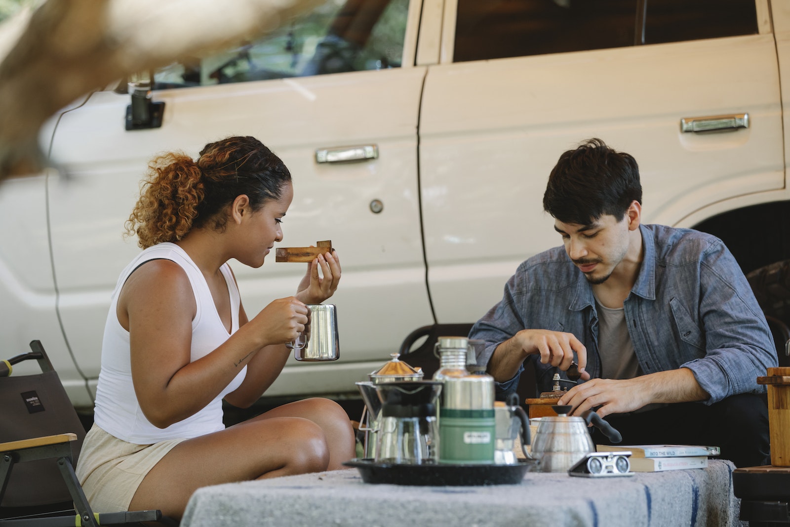 couple enjoying hot drinks and sandwiches