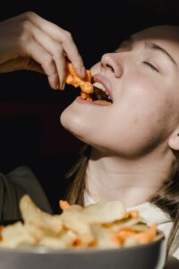 woman eating popcorn