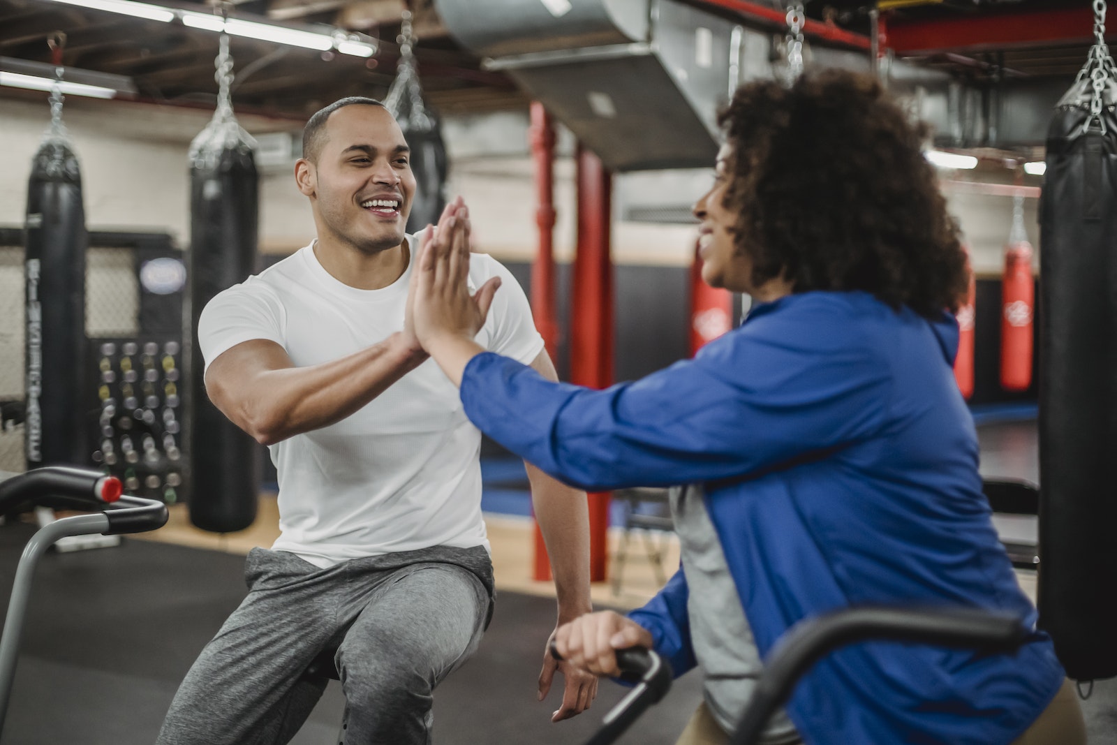 trainee and male instructor clapping hands