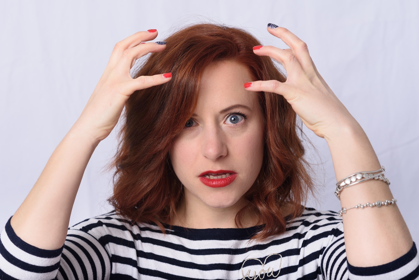 woman in white striped long sleeve shirt