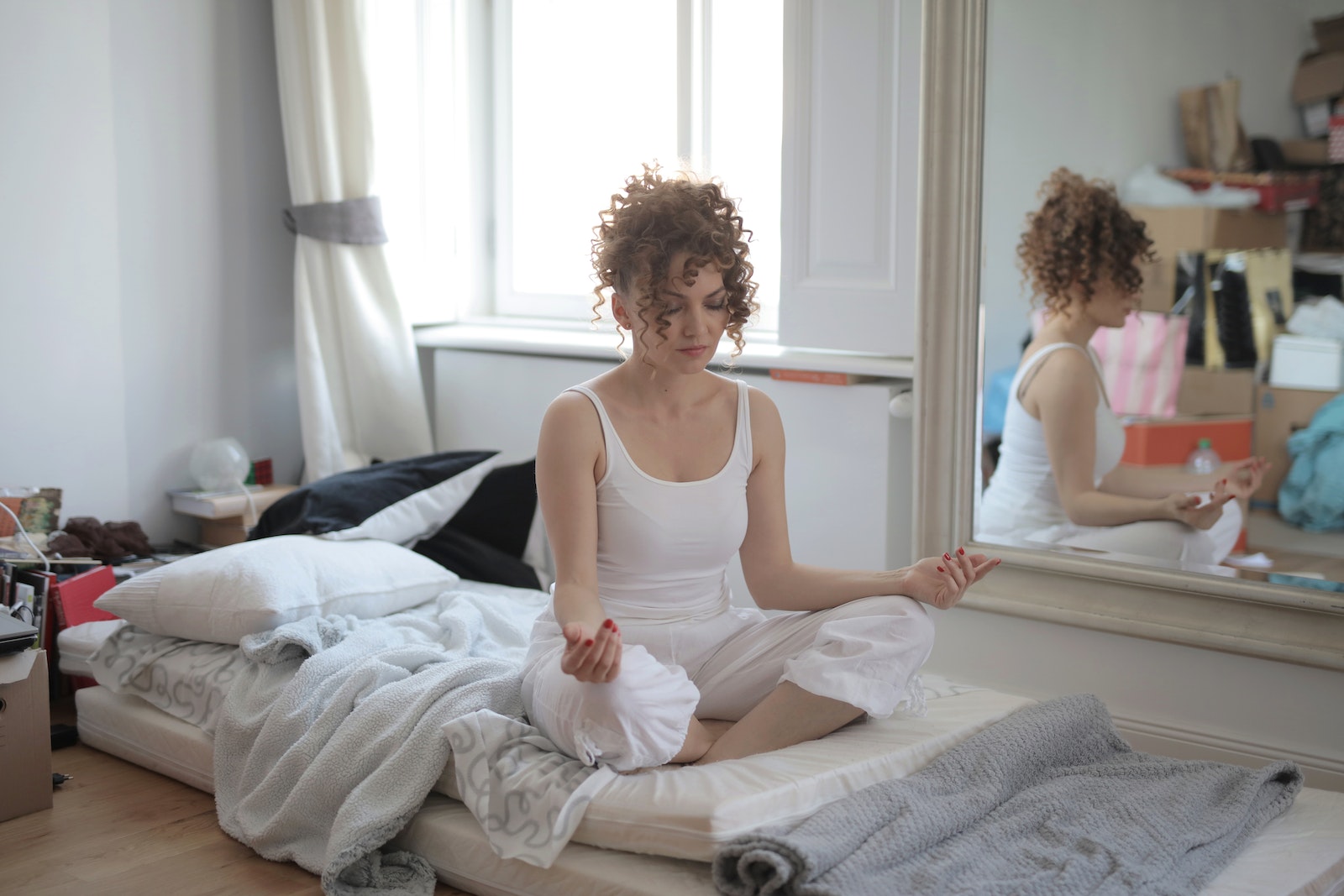 woman practicing yoga with closed eyes